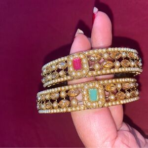 Two piece set of Elegant Gold and Multicolor stones with white beads Bangles new